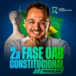 Foto promocional do professor Ítalo Rebouças sorrindo, à frente da estátua da Justiça (Themis) e da bandeira do Brasil desfocada ao fundo. Abaixo, o texto em destaque azul e verde diz '2ª Fase OAB Constitucional Regular'. No canto superior direito, a logomarca 'IR Curso Preparatório'.